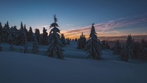 Sunrise in beautiful snowy forest in wild winter nature Time-lapse Outdoor Background