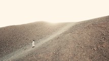 a man alone in the desert 