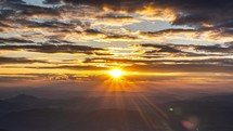 Golden light of sun at beautiful summer sunset time lapse
