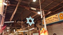 The star of David hanging in a Israeli market in the Holy Land.