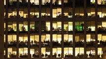 office building windows at night - editorial use only
