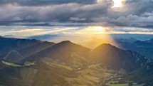 Golden light of sun paint the mountains landscape at beautiful sunrise time lapse
