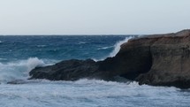 rough sea breaks on the rock
