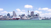Sailing by Auckland city ocean bay to CBD harbor in New Zealand holiday center
