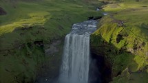 Aerial view of Skogafos waterfall during sunny evening in Iceland.

