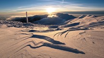 Sunrise over beautiful snow structure in frozen winter alps mountains nature background
