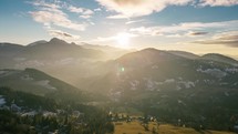 Panorama of sunset in autumn alpine mountains countryside Aerial view Hyper Time lapse
