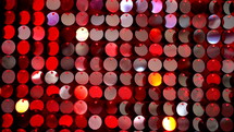 Sequins sparkling reflective background. Abstract kinetic glitter wall moving. Night club decoration. Can be used as transitions, added to modern projects, art backgrounds.