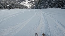 Enjoying skiing in fresh snow powder in small alpine ski resort slow motion
