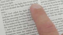 finger pointing to scripture 