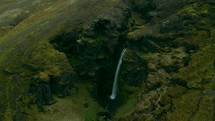 waterfall off a green mountainside 