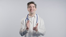 Happy young american physician man in white medical coat form applauding. Smiling mature medical professional emotional claps hands, congratulating. Support, cheering, gratitude concept. 4k