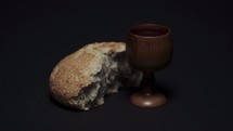 wooden chalice and bread loaf 