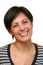 Close up portrait of a cheerful young woman smiling on white background