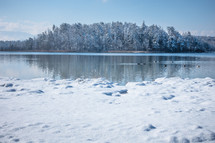 snow on a winter lake shore 