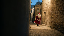 Santa Claus around the street on Christmas night