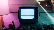 Colorful composition of old static tv and christmas decorations