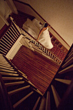 A bride walking down a staircase 