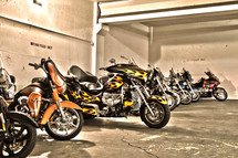 parked group of motorcycles lined up