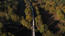 Aerial shot of train through countryside