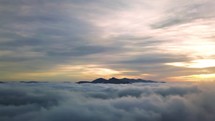Aerial view of Mysterious sky in misty mountains nature at sunrise