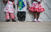 Children standing on sidewalk