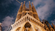 December 2021 - Barcelona Spain. Night timelapse of Gaudi's masterpiece - Sagrada Familia Basilica. UNESCO world heritage. View of outdoor interior, Impressive facade. High quality 4k footage