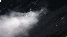 Mist rising up in rocky mountain range