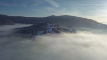 Aerial view of misty forest in winter landscape
