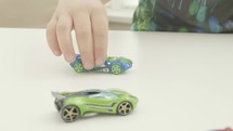 boy playing toy cars 