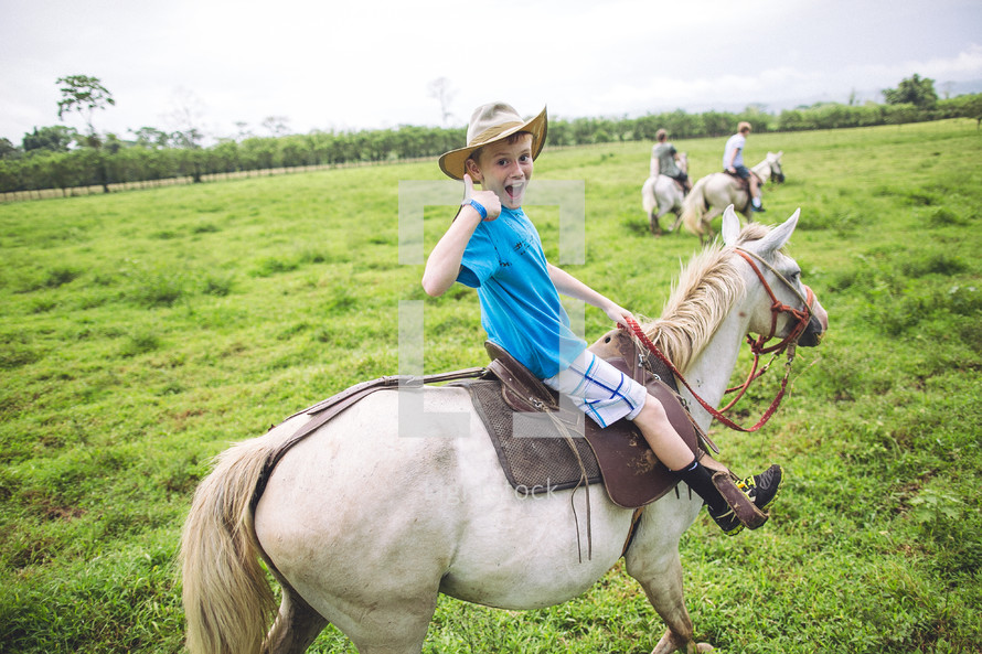 child riding a pony
