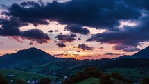 Colorful Sunrise sky clouds motion over Europe rural countryside landscape time-lapse
