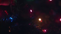 Close up of putting up Christmas tree lights.