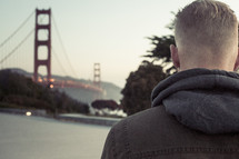 a man looking out at the Golden Gate Bridge 