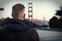 a man looking out at the Golden gate bridge 