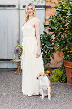 dog sitting next to a bride wedding fashion