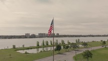 American flag on a river shore 