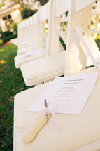 Wedding program on chair