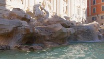 Sun reflections on the water of Trevi Fountain