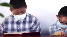 brother reading Bibles together 