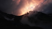 Scenic low clouds in Alps of Switzerland during sunset