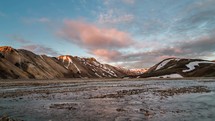 Sunset colors over river and mountains in Iceland Landmannalaugar. Time lapse pan
