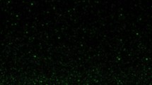 3D green glow sparks particles on black bg move up