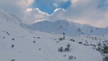 Panorama of winter alps mountains in cloudy day with fresh snow, Ski touring background
