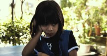 Bored little girl in the Philippines