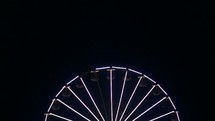 lights on a spinning ferris wheel 