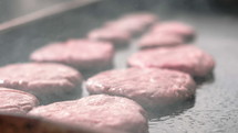 steam from hamburgers on a grill 