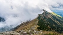 Mystic mountain hidden in dramatic clouds in alpine nature landscape Time lapse
