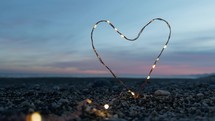 Heart symbol sparkles at sunset