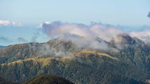 Foggy clouds moving over mountains ridge in Tararua Range Forest park in New Zealand wild nature Time-lapse
